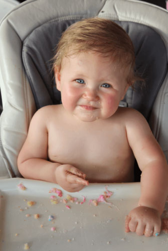 a baby sitting in a high chair