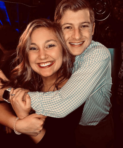 a couple of people posing for the camera