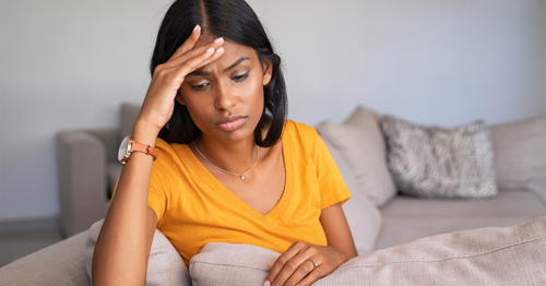 a woman sitting on a bed