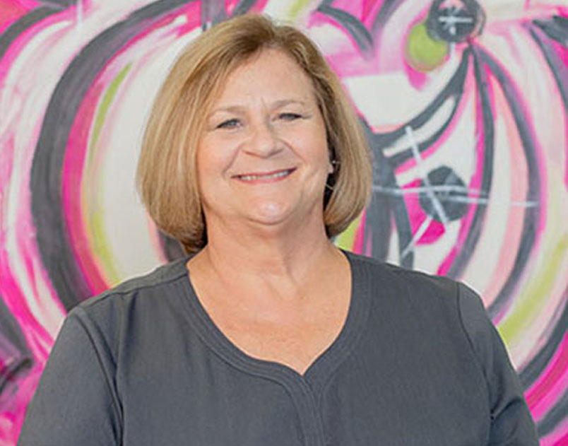 a woman smiling for the camera